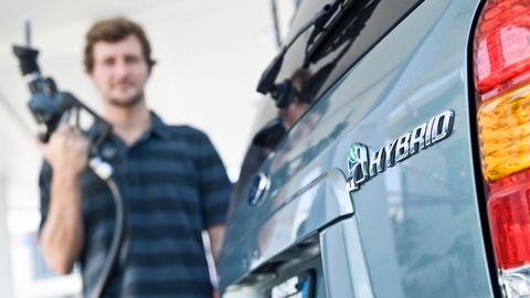 Man refueling hybrid car