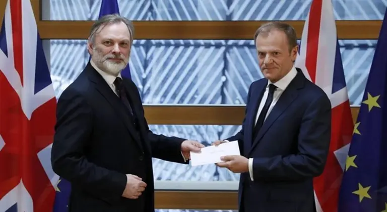 Britain's permanent representative to the European Union Tim Barrow delivers British Prime Minister Theresa May's Brexit letter in notice of the UK's intention to leave the bloc under Article 50 of the EU's Lisbon Treaty to EU Council President Donald Tusk in Brussels, Belgium March 29, 2017.   REUTERS/Yves Herman