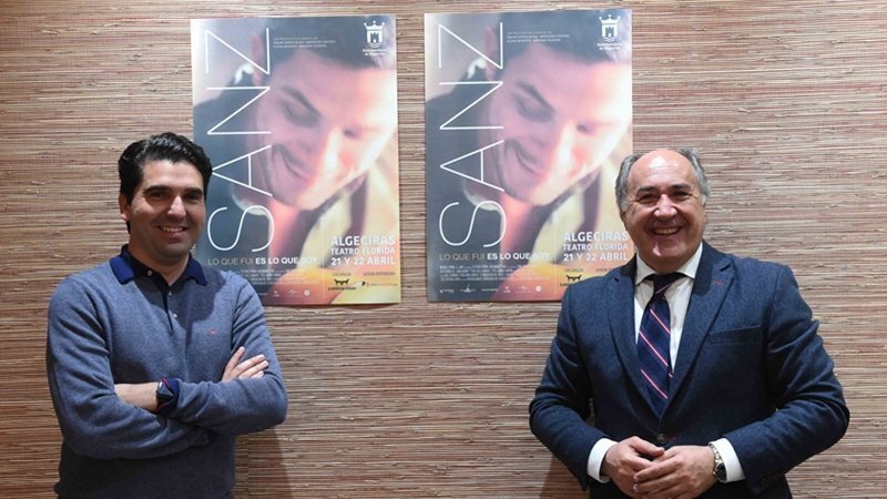 Landaluce e Hidalgo, con el cartel anunciador de la actividad